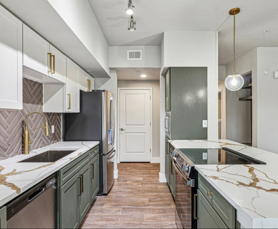 galley kitchen with ample lighting